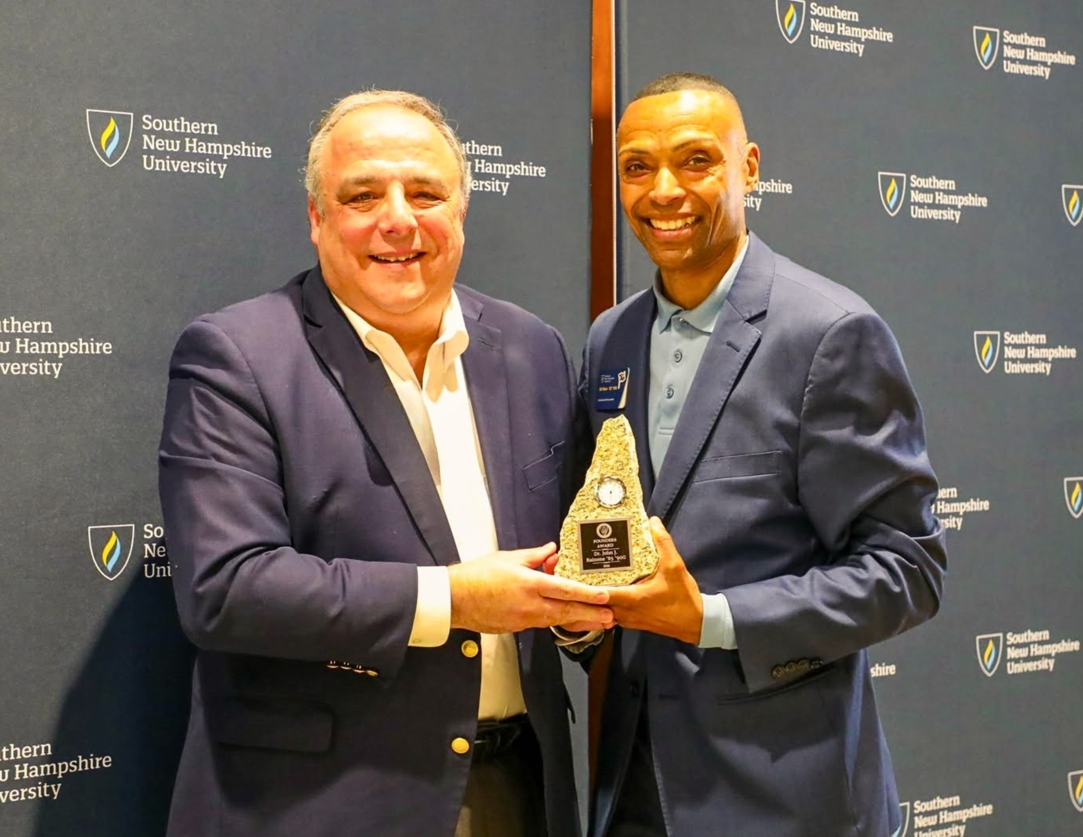 MGCC President Dr. John Rainone is presented with the SNHU Founders Award by Sr. Director of Development, Ed Ithier. 