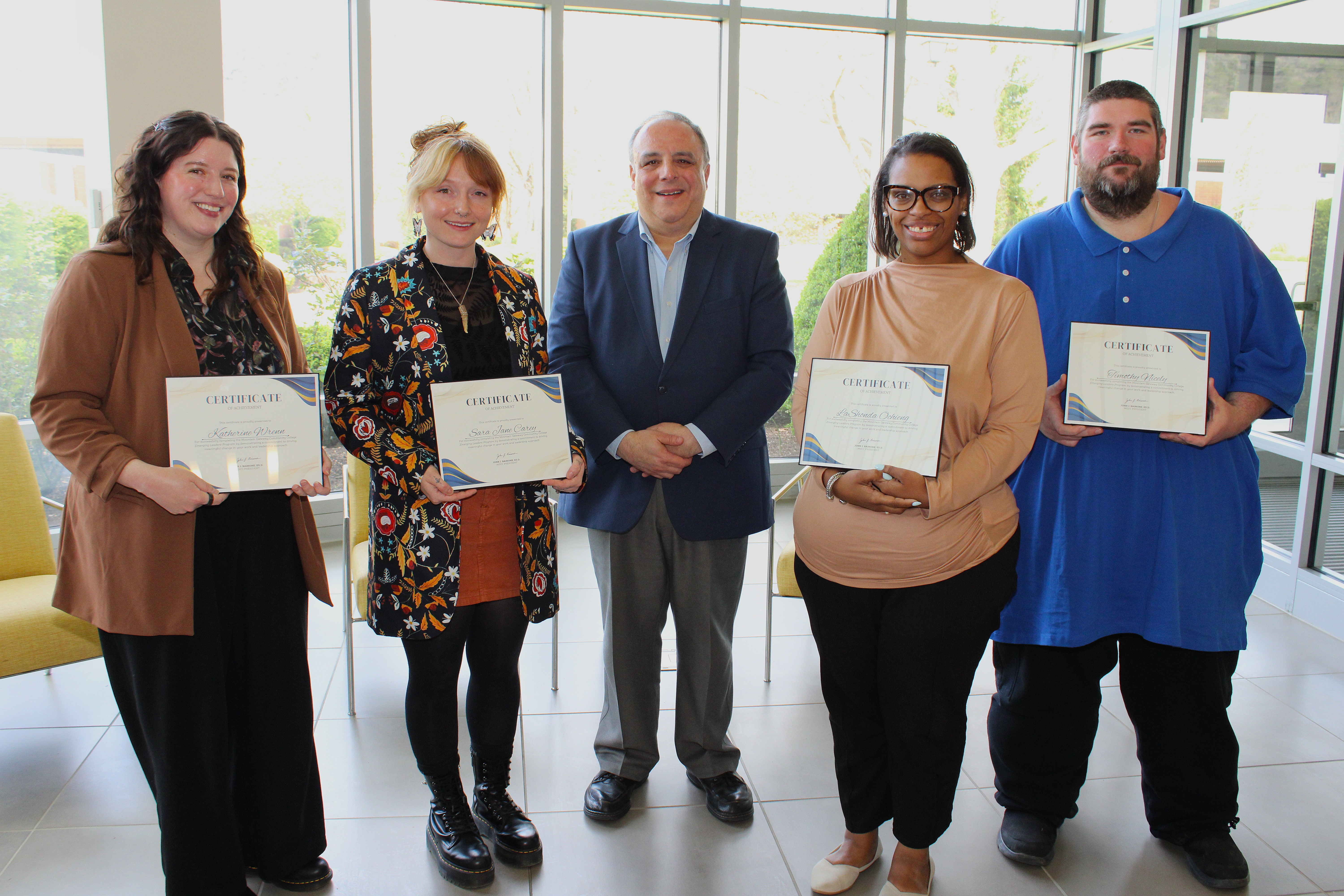 Graduates of the MGCC Emerging Leaders program pose with the certificates of achievement