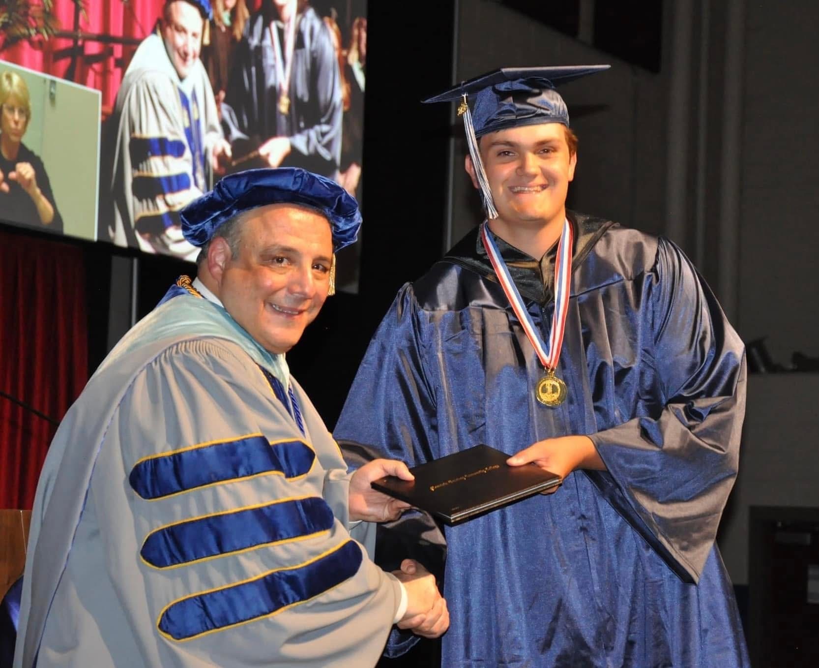 Dr. Rainone handing out diploma