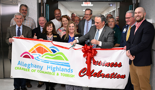 Leadership team holding banner